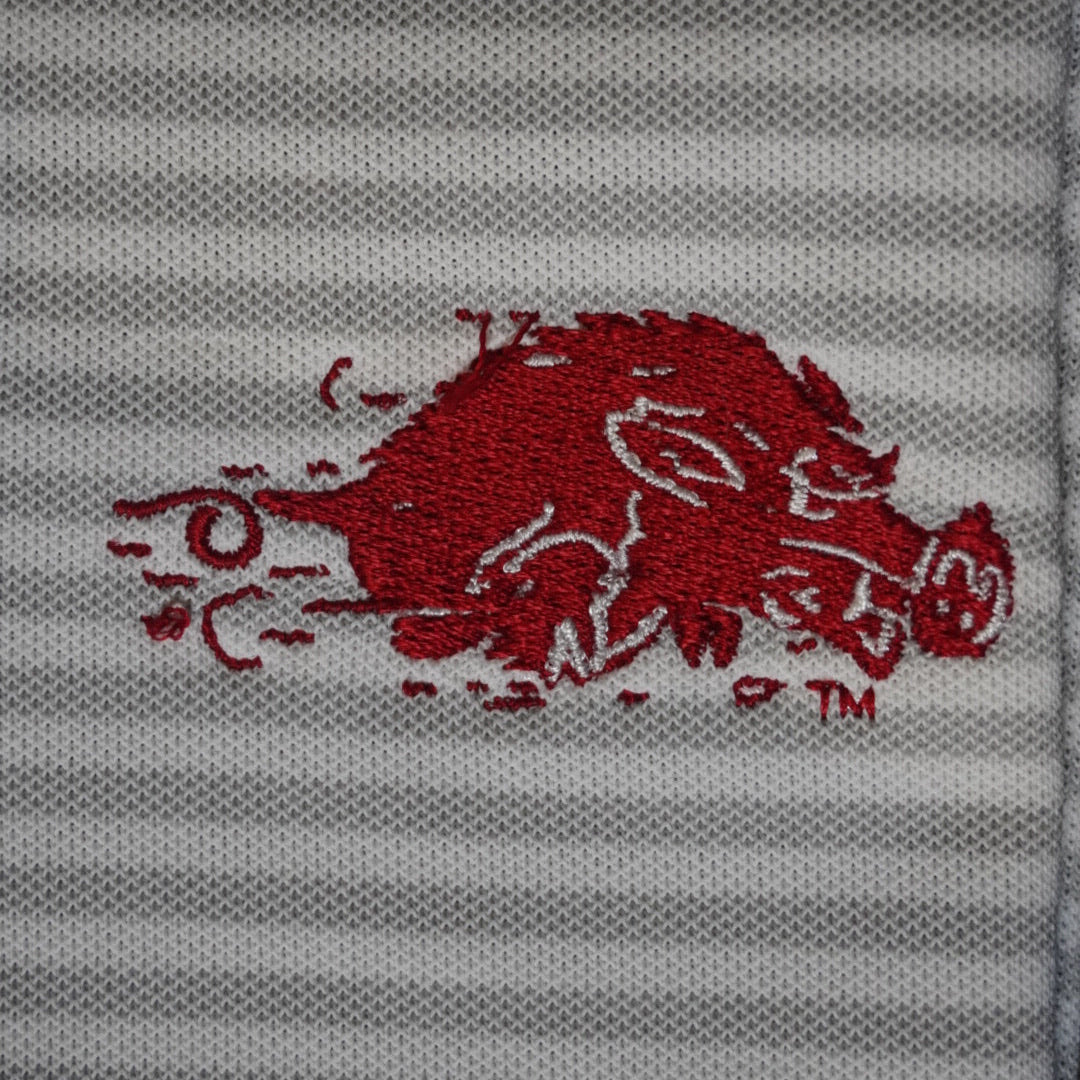Red logo on a gray striped background