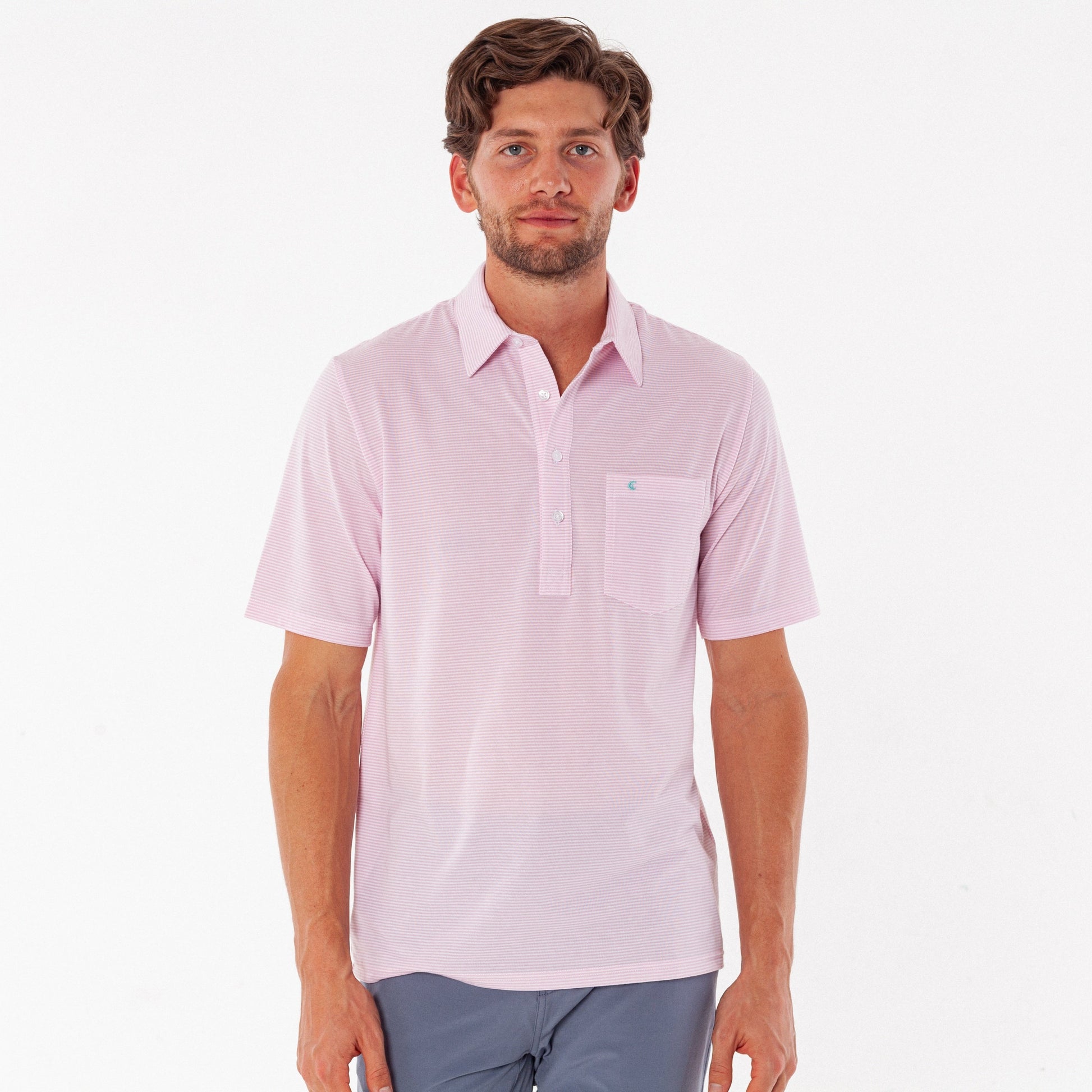Man wearing a light pink short-sleeve shirt on a white background