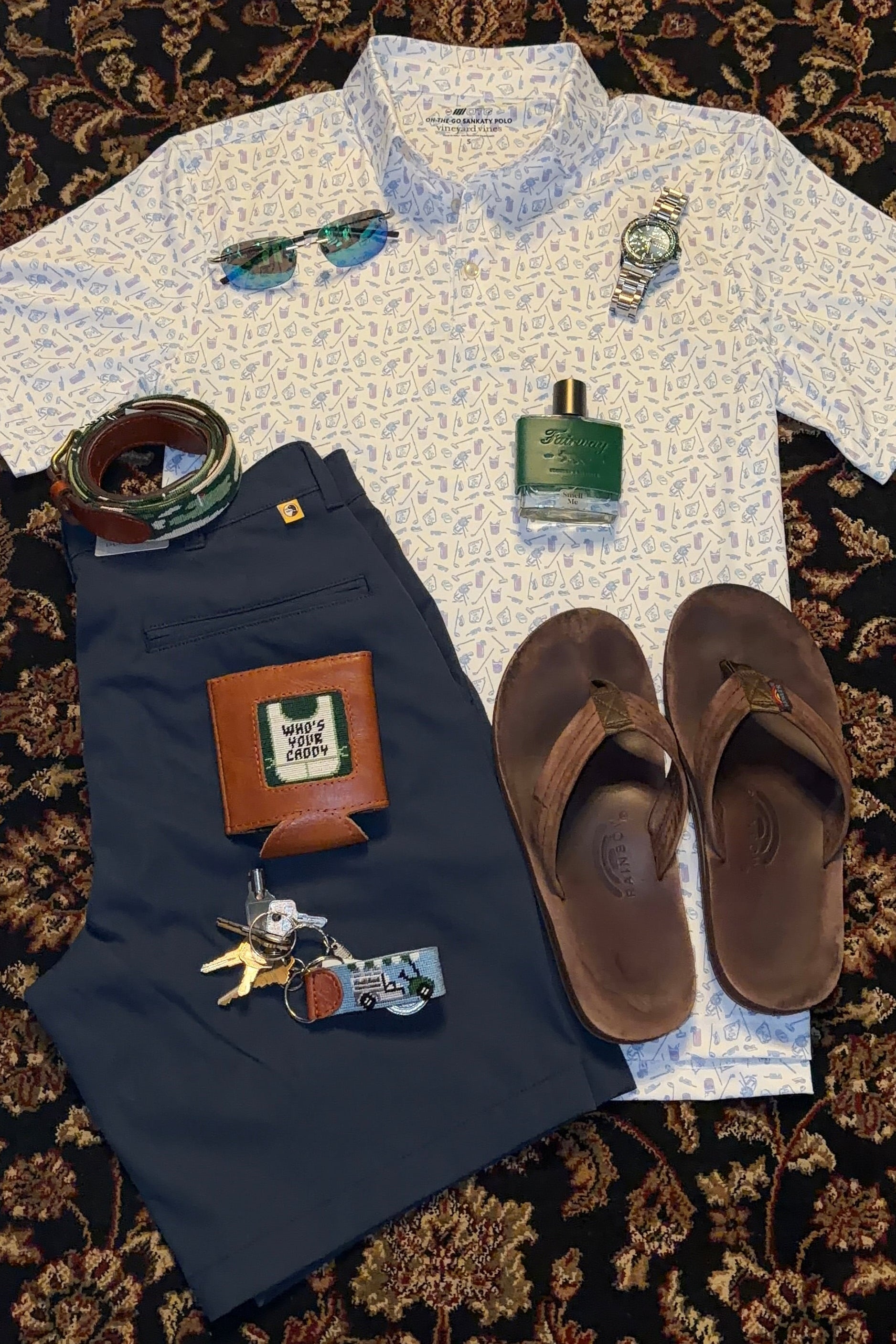 White shirt with decorative elements on a dark patterned surface